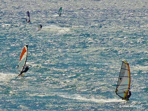 wind surfing on the santa cruz coast by Uwe Muegge